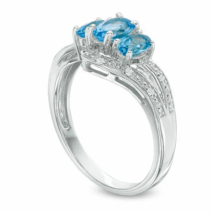 Goldia Rings Oval Blue and White Topaz Three Stone Bypass Ring in Sterling Silver