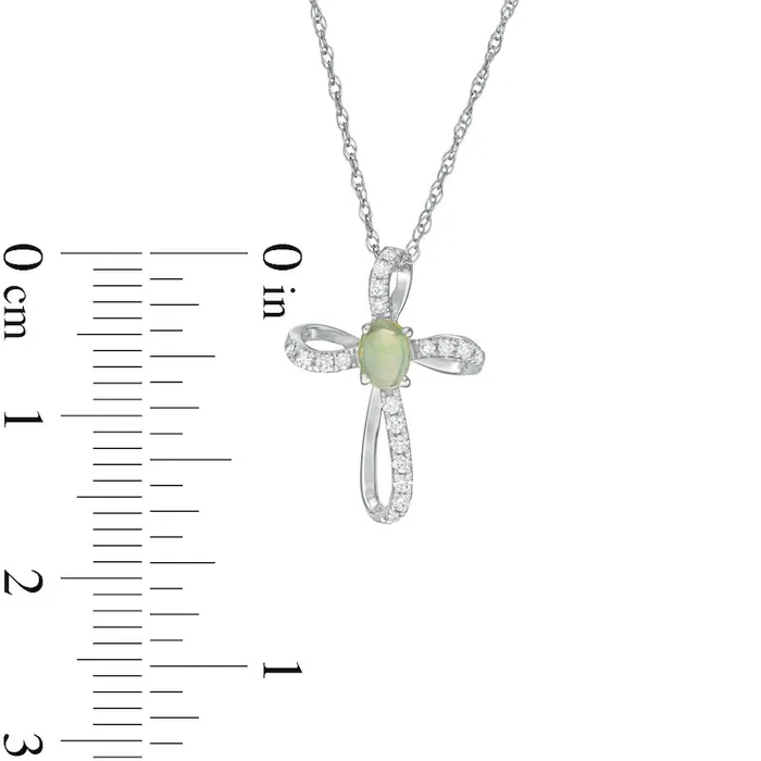 Oval Opal and 01 CT TW Natural Diamond Pinwheel Cross Pendant in 10K White Gold Goldia Necklaces